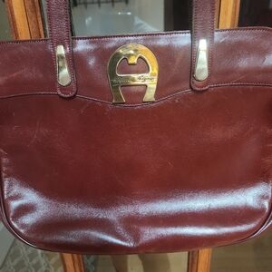 Brown Shoulder Bag with Glossy Finish and Elegant Design
